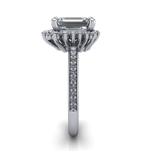 Persephone emerald halo engagement ring in Platinum, side profile showing the pear and round accent cluster and the pav&eacute; diamonds down the shank