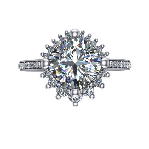 Persephone cushion halo engagement ring in Platinum, top-down view showing the center diamond ringed by a snowflake halo of round and pear accent diamonds