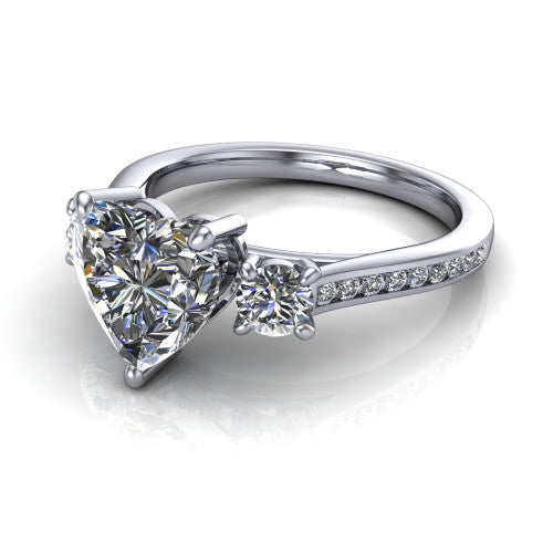 Saoirse heart three stone engagement ring in 18K White Gold, three-quarter perspective showing the center diamond between two round side stones above a pav&eacute; shank