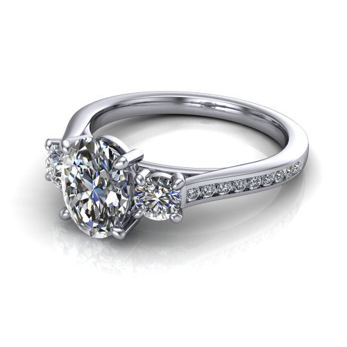 Saoirse oval three stone engagement ring in 18K White Gold, three-quarter perspective showing the center diamond between two round side stones above a pav&eacute; shank