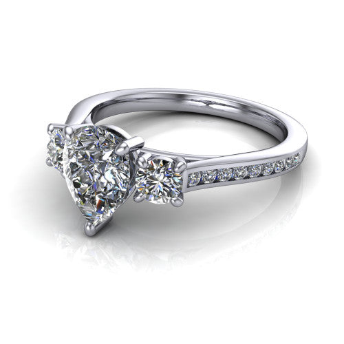 Saoirse pear three stone engagement ring in 18K White Gold, three-quarter perspective showing the center diamond between two round side stones above a pav&eacute; shank