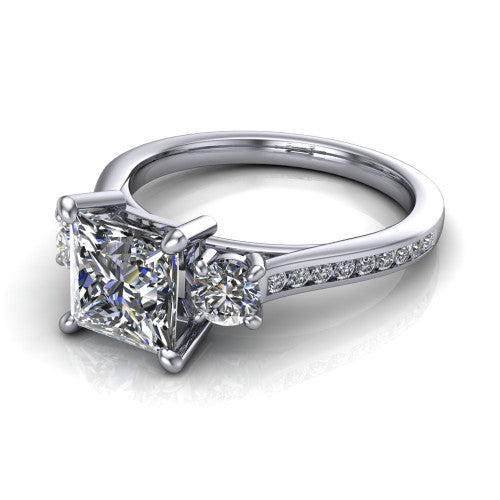 Saoirse princess three stone engagement ring in 14K White Gold, three-quarter perspective showing the center diamond between two round side stones above a pav&eacute; shank