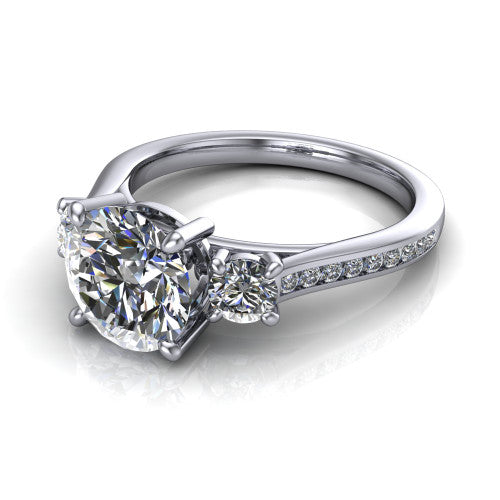 Saoirse round three stone engagement ring in 18K White Gold, three-quarter perspective showing the center diamond between two round side stones above a pav&eacute; shank