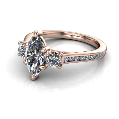 Saoirse marquise three stone engagement ring in 18K Rose Gold, three-quarter perspective showing the center diamond between two round side stones above a pav&eacute; shank