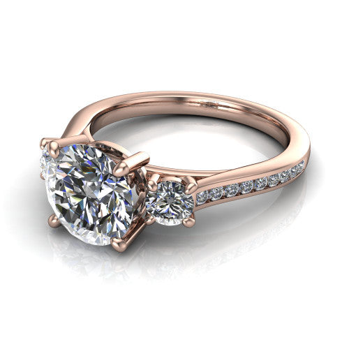 Saoirse round three stone engagement ring in 18K Rose Gold, three-quarter perspective showing the center diamond between two round side stones above a pav&eacute; shank