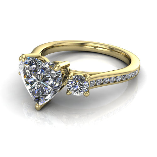 Saoirse heart three stone engagement ring in 14K Yellow Gold, three-quarter perspective showing the center diamond between two round side stones above a pav&eacute; shank