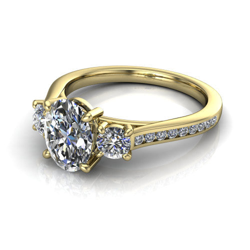 Saoirse oval three stone engagement ring in 14K Yellow Gold, three-quarter perspective showing the center diamond between two round side stones above a pav&eacute; shank