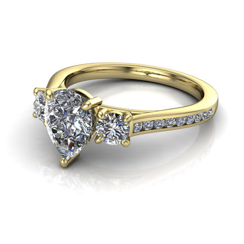 Saoirse pear three stone engagement ring in 14K Yellow Gold, three-quarter perspective showing the center diamond between two round side stones above a pav&eacute; shank