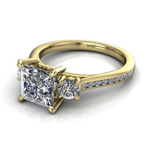 Saoirse princess three stone engagement ring in 14K Yellow Gold, three-quarter perspective showing the center diamond between two round side stones above a pav&eacute; shank