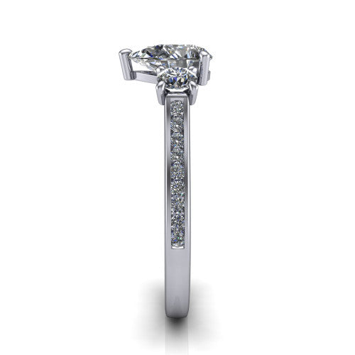 Saoirse pear three stone engagement ring in 14K White Gold, side profile showing the round side stone and the pav&eacute; diamonds running down the shank