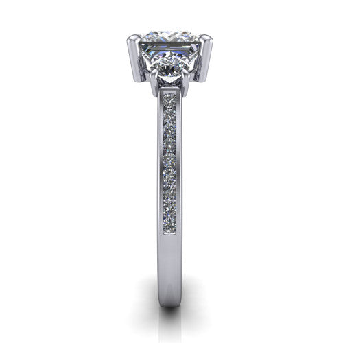 Saoirse princess three stone engagement ring in 18K White Gold, side profile showing the round side stone and the pav&eacute; diamonds running down the shank