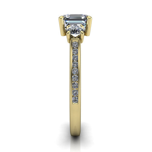 Saoirse asscher three stone engagement ring in 14K Yellow Gold, side profile showing the round side stone and the pav&eacute; diamonds running down the shank