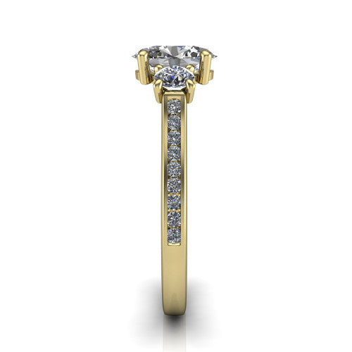 Saoirse oval three stone engagement ring in 18K Yellow Gold, side profile showing the round side stone and the pav&eacute; diamonds running down the shank