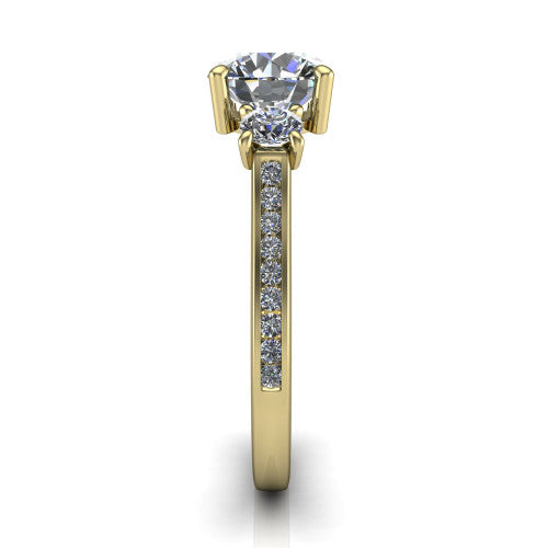Saoirse round three stone engagement ring in 14K Yellow Gold, side profile showing the round side stone and the pav&eacute; diamonds running down the shank