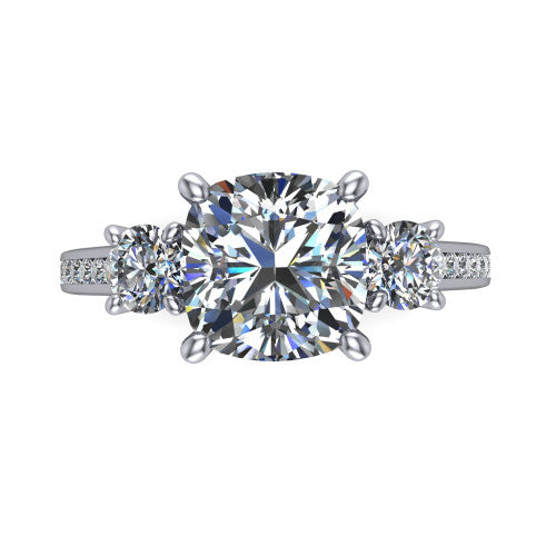 Saoirse cushion three stone engagement ring in 14K White Gold, top-down view showing the center diamond flanked by two round side stones in a three stone setting