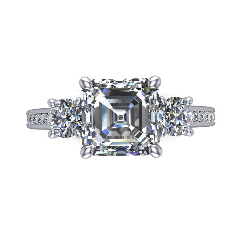 Saoirse asscher three stone engagement ring in Platinum, top-down view showing the center diamond flanked by two round side stones in a three stone setting