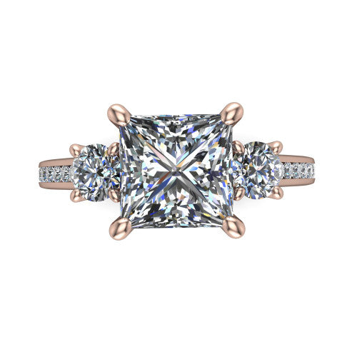 Saoirse princess three stone engagement ring in 14K Rose Gold, top-down view showing the center diamond flanked by two round side stones in a three stone setting