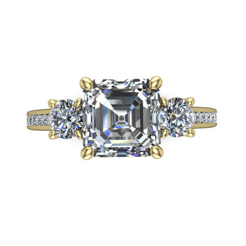 Saoirse asscher three stone engagement ring in 14K Yellow Gold, top-down view showing the center diamond flanked by two round side stones in a three stone setting