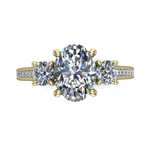Saoirse oval three stone engagement ring in 18K Yellow Gold, top-down view showing the center diamond flanked by two round side stones in a three stone setting