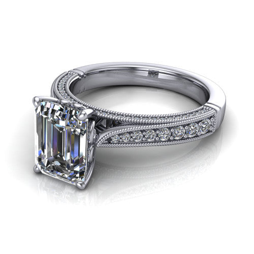 Maeve emerald classic engagement ring in Platinum, three-quarter perspective showing the solitaire center diamond raised above a milgrain-edged pav&eacute; shank