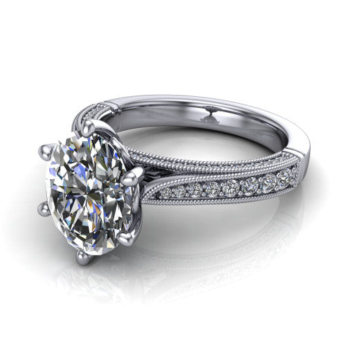 Maeve oval classic engagement ring in 18K White Gold, three-quarter perspective showing the solitaire center diamond raised above a milgrain-edged pav&eacute; shank