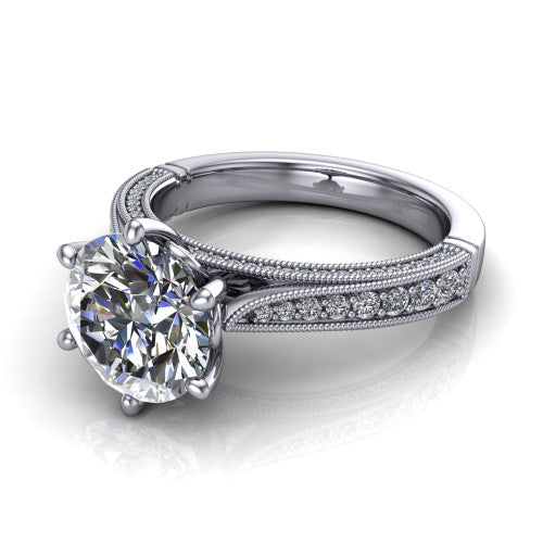Maeve round classic engagement ring in Platinum, three-quarter perspective showing the solitaire center diamond raised above a milgrain-edged pav&eacute; shank