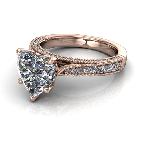 Maeve heart classic engagement ring in 18K Rose Gold, three-quarter perspective showing the solitaire center diamond raised above a milgrain-edged pav&eacute; shank
