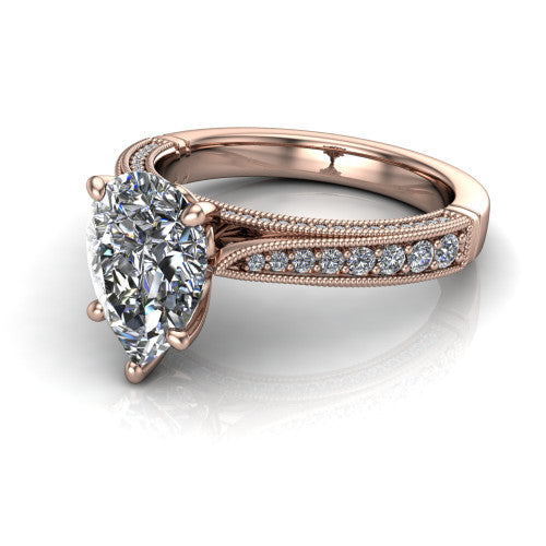 Maeve pear classic engagement ring in 18K Rose Gold, three-quarter perspective showing the solitaire center diamond raised above a milgrain-edged pav&eacute; shank