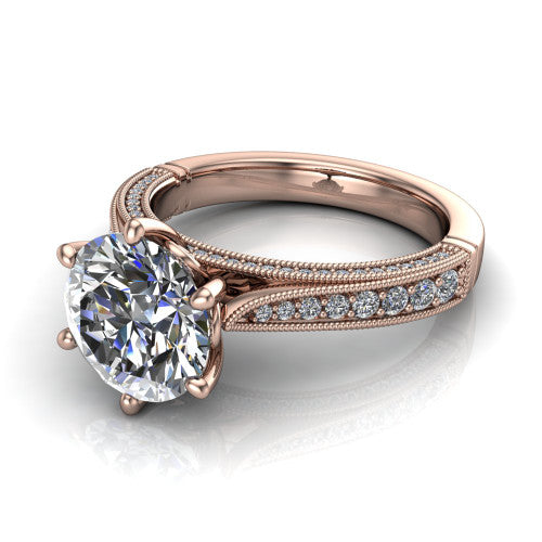 Maeve round classic engagement ring in 14K Rose Gold, three-quarter perspective showing the solitaire center diamond raised above a milgrain-edged pav&eacute; shank