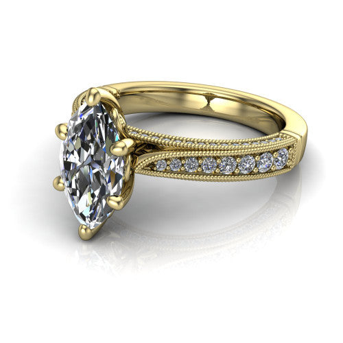 Maeve marquise classic engagement ring in 18K Yellow Gold, three-quarter perspective showing the solitaire center diamond raised above a milgrain-edged pav&eacute; shank