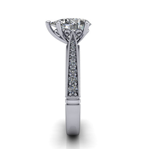 Maeve pear classic engagement ring in 18K White Gold, side profile showing the milgrain edges and the round diamonds running down the shank