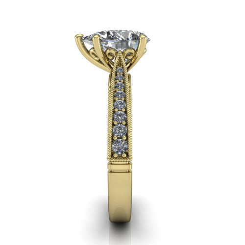 Maeve pear classic engagement ring in 14K Yellow Gold, side profile showing the milgrain edges and the round diamonds running down the shank