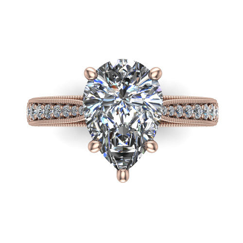 Maeve pear classic engagement ring in 18K Rose Gold, top-down view showing the prong-set center diamond over a diamond-set milgrain band