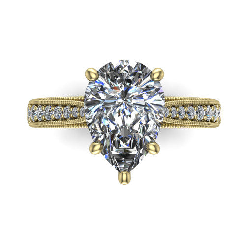 Maeve pear classic engagement ring in 18K Yellow Gold, top-down view showing the prong-set center diamond over a diamond-set milgrain band