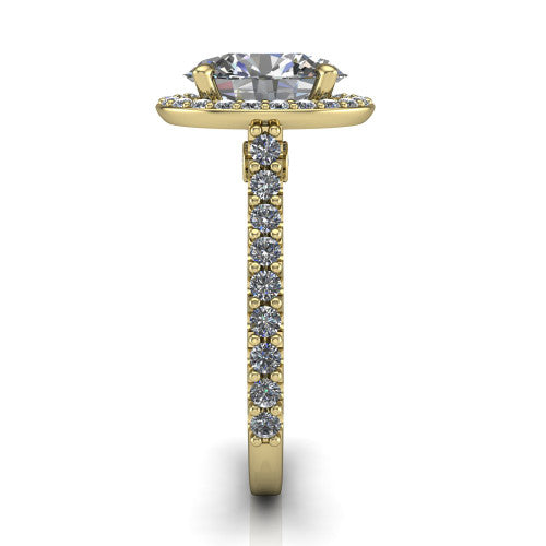 Rowan oval halo engagement ring in 14K Yellow Gold, side profile showing the pav&eacute; diamonds running down the shank and the hidden gallery accent