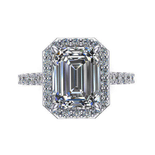 Rowan emerald halo engagement ring in Platinum, top-down view showing the center diamond framed by a pav&eacute; halo with decorative corner prongs