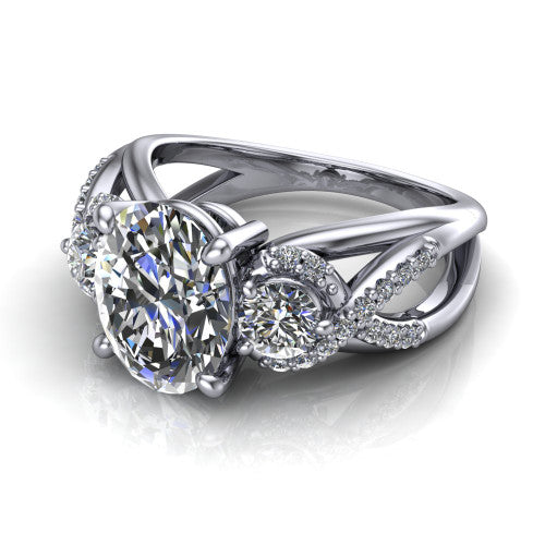 Amara oval three stone engagement ring in 18K White Gold, three-quarter perspective showing the center diamond between two round side stones above an infinity-twist pav&eacute; shank