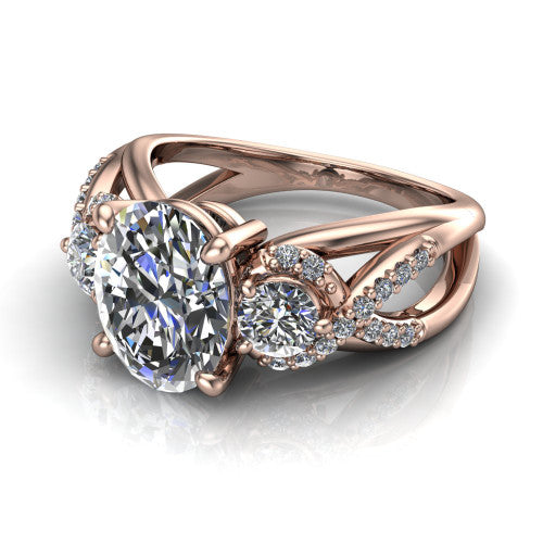 Amara oval three stone engagement ring in 18K Rose Gold, three-quarter perspective showing the center diamond between two round side stones above an infinity-twist pav&eacute; shank