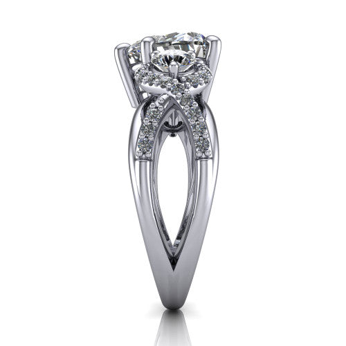 Amara heart three stone engagement ring in 18K White Gold, side profile showing the pav&eacute; rails crossing in an infinity twist beneath the head