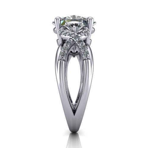 Amara oval three stone engagement ring in 18K White Gold, side profile showing the pav&eacute; rails crossing in an infinity twist beneath the head