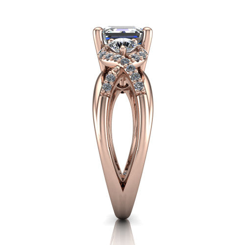 Amara asscher three stone engagement ring in 14K Rose Gold, side profile showing the pav&eacute; rails crossing in an infinity twist beneath the head