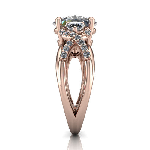 Amara oval three stone engagement ring in 14K Rose Gold, side profile showing the pav&eacute; rails crossing in an infinity twist beneath the head