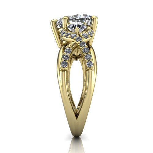 Amara heart three stone engagement ring in 18K Yellow Gold, side profile showing the pav&eacute; rails crossing in an infinity twist beneath the head