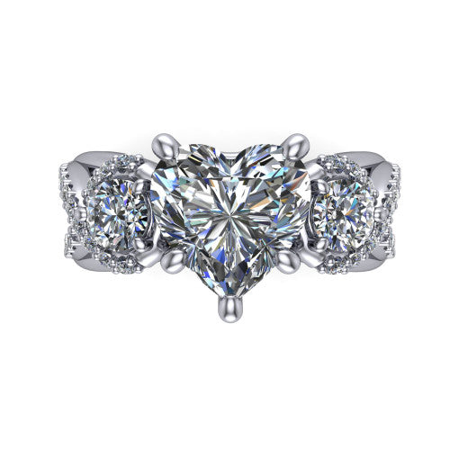 Amara heart three stone engagement ring in 18K White Gold, top-down view showing the center diamond flanked by two round side stones woven into a pav&eacute; infinity twist