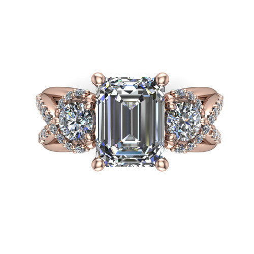 Amara emerald three stone engagement ring in 18K Rose Gold, top-down view showing the center diamond flanked by two round side stones woven into a pav&eacute; infinity twist