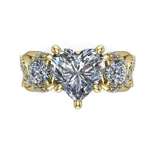 Amara heart three stone engagement ring in 18K Yellow Gold, top-down view showing the center diamond flanked by two round side stones woven into a pav&eacute; infinity twist