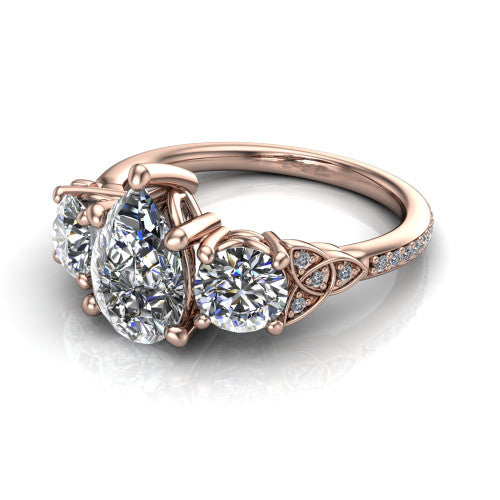 Zion pear three stone engagement ring in 18K Rose Gold, three-quarter perspective showing the center diamond between two round side stones with Celtic trinity-knot shoulders above a pav&eacute; shank