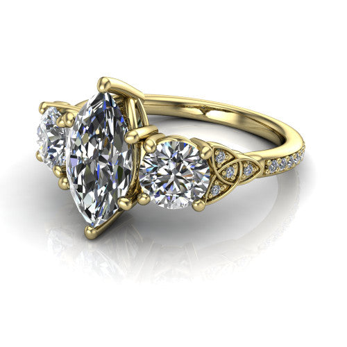 Zion marquise three stone engagement ring in 14K Yellow Gold, three-quarter perspective showing the center diamond between two round side stones with Celtic trinity-knot shoulders above a pav&eacute; shank