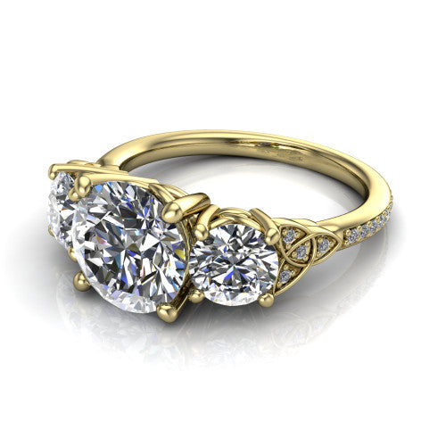 Zion round three stone engagement ring in 14K Yellow Gold, three-quarter perspective showing the center diamond between two round side stones with Celtic trinity-knot shoulders above a pav&eacute; shank