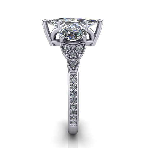 Zion marquise three stone engagement ring in Platinum, side profile showing the trinity-knot shoulder and the pav&eacute; diamonds running down the shank